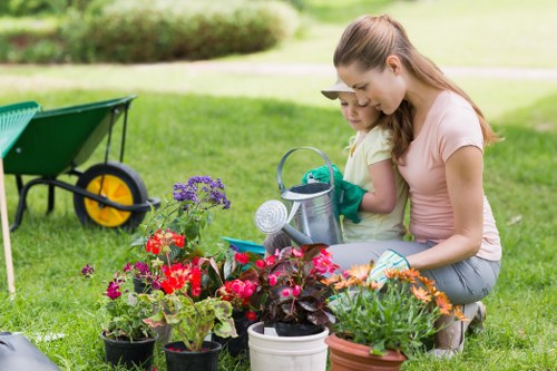 Lawn mowing and hedge trimming as part of gardening services in Woodlands